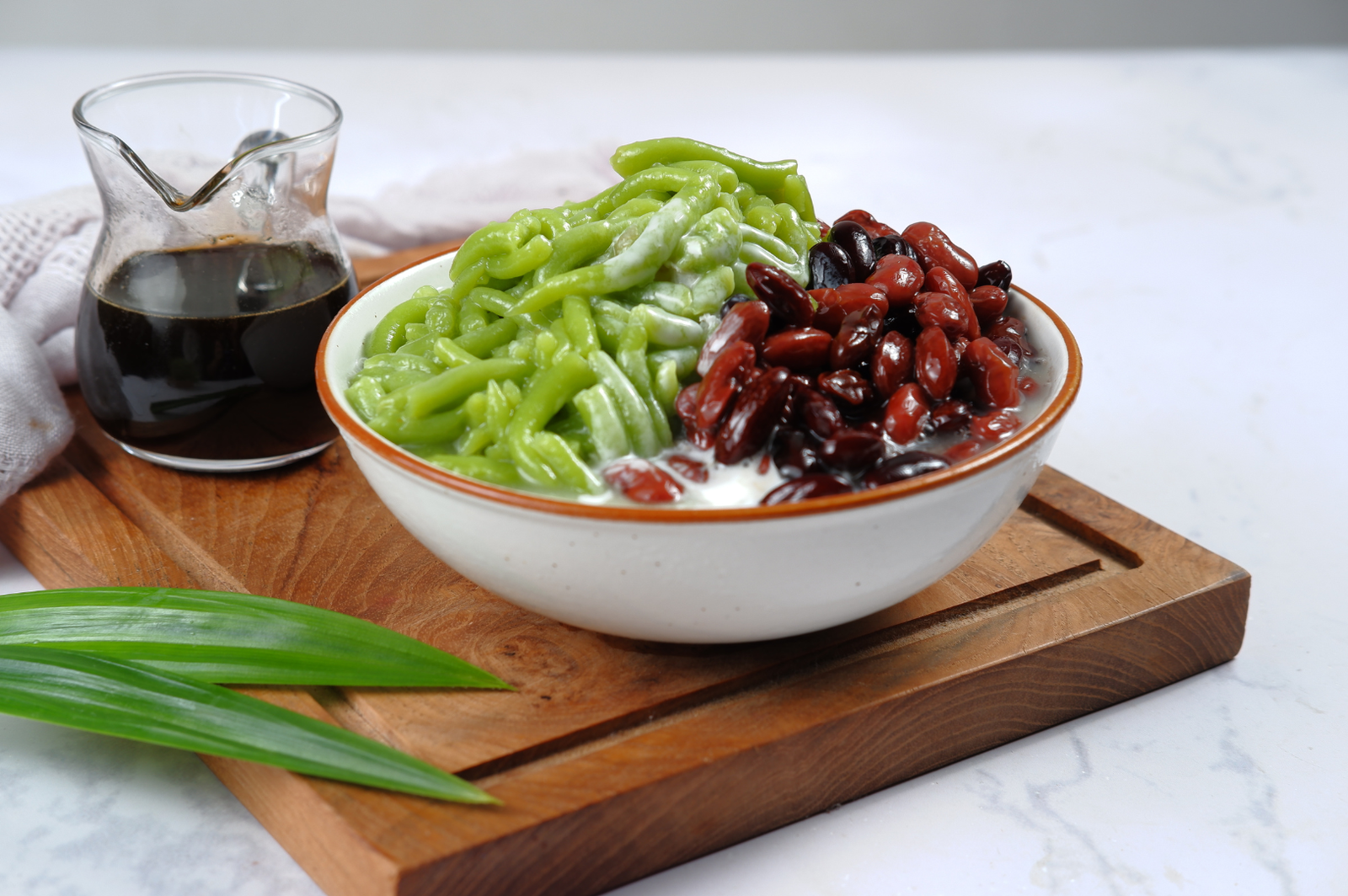 Cendol with shaved ice, green rice-flour jelly, red beans and palm sugar syrup