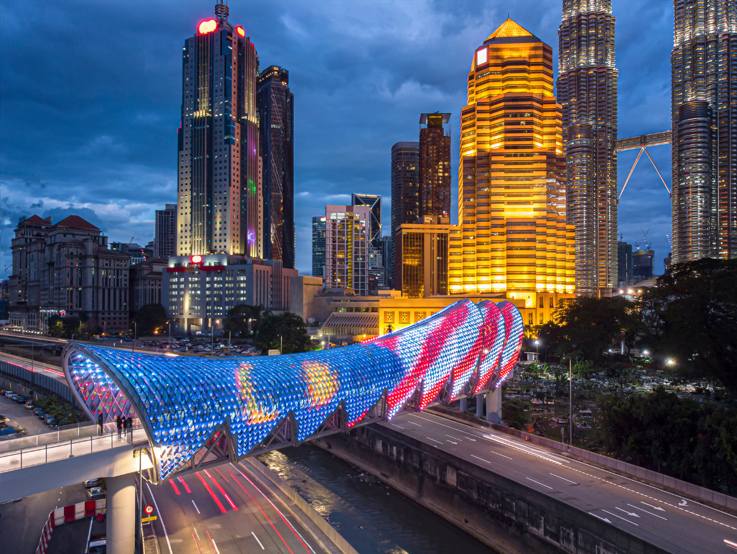 Saloma Link pedestrian bridge illuminated at dusk