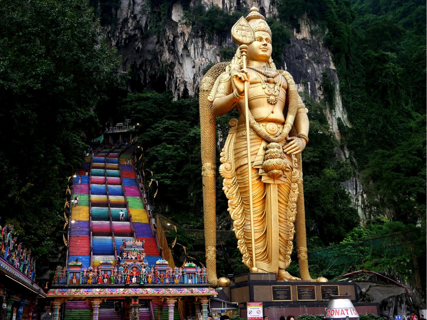 Golden statue and rainbow staircase at Batu Caves